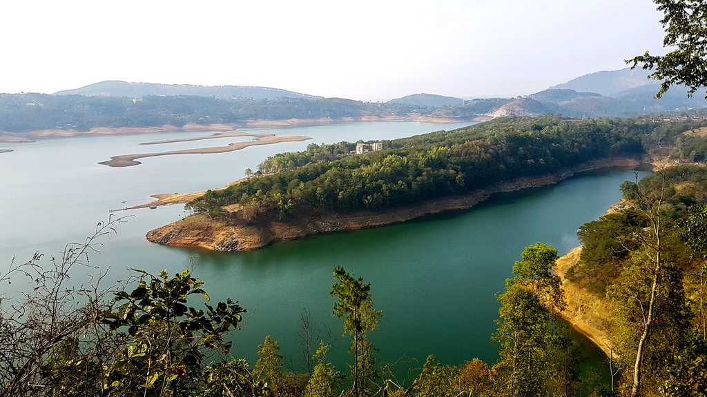 Umiam Lake in Meghalaya reflecting the sky and lush greenery