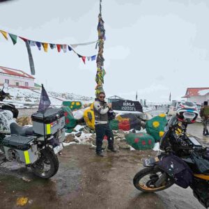 Tawang bike trip group at Bum La Pass on the Indo-China border