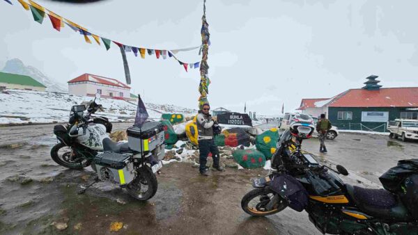 Tawang bike trip group at Bum La Pass on the Indo-China border