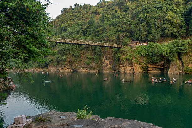 Group boating on the crystal-clear Umngot River in Dawki, Meghalaya