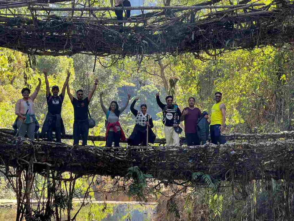 Group of travelers exploring Meghalaya’s scenic landscape together