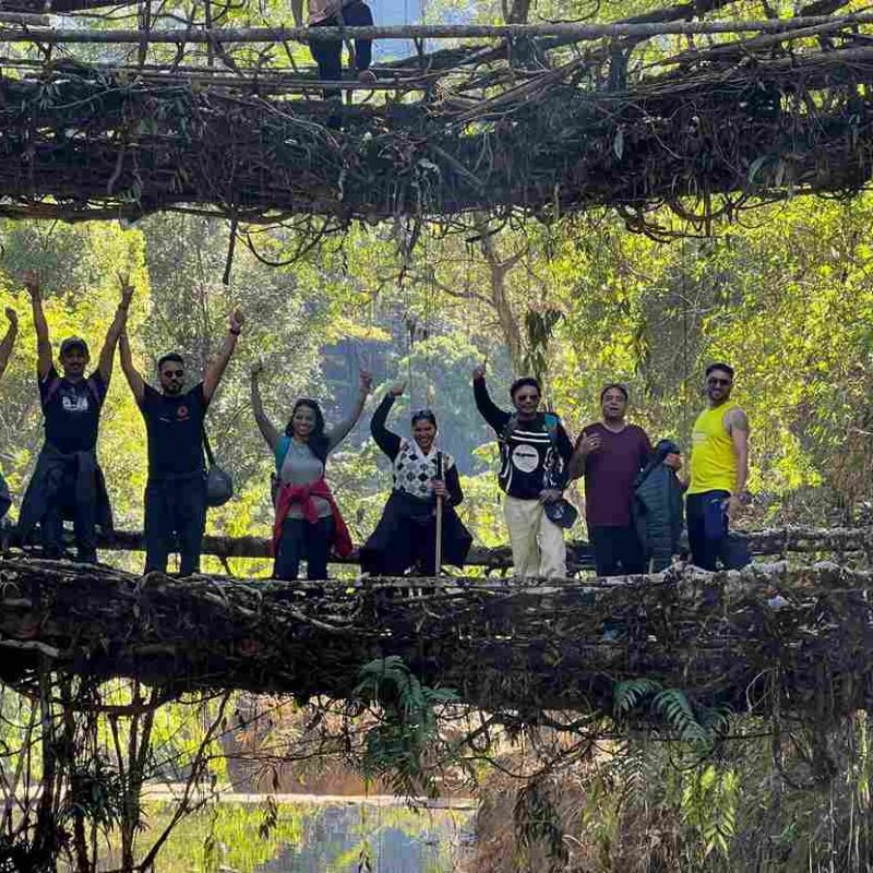 Group of travelers exploring Meghalaya’s scenic landscape together