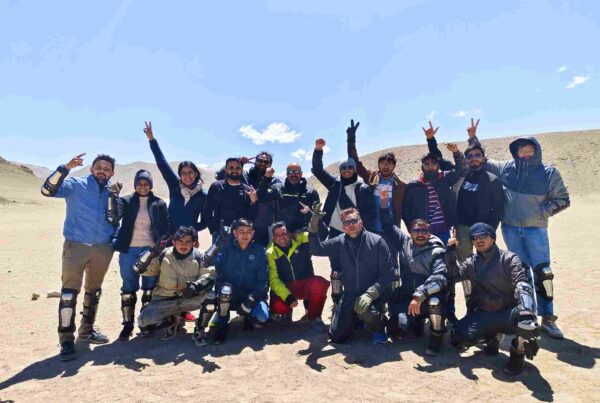 Group of bikers at Nubra Valley sand dunes during June bike trip in Ladakh