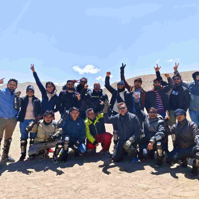 Group of bikers at Nubra Valley sand dunes during June bike trip in Ladakh