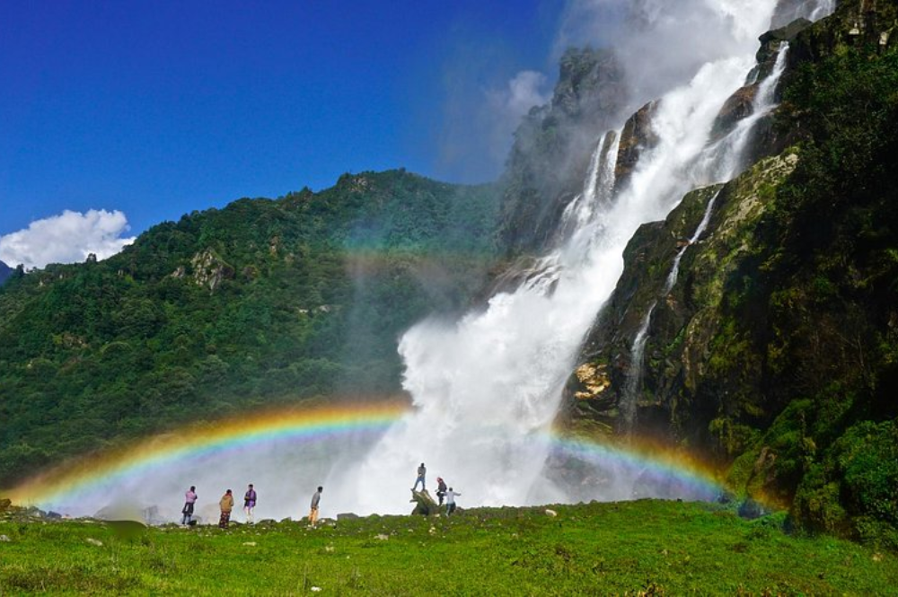 Nuranang Falls cascading through forested hills