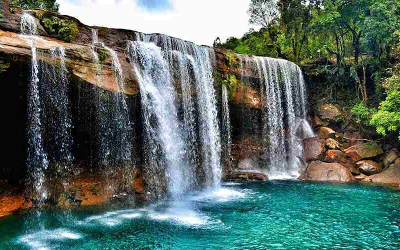 Meghalaya Group Tour Package with scenic mountain views and travellers
